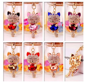 Detailed view of rhinestone cat keychains in seven vibrant colors with crystal accents