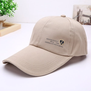 Close-up of khaki baseball cap featuring golden shield embroidery and sports lettering
