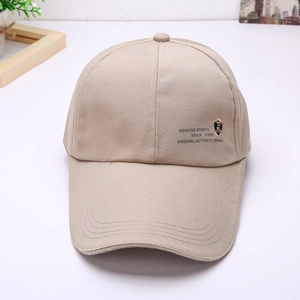Detail view of khaki cotton baseball cap with long brim and Genuine Sports logo