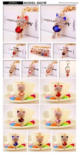 Detail of colorful gemstone lucky cat keychain with sparkling crystal rhinestones