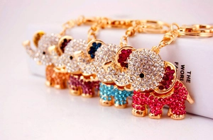 Detail view of colorful rhinestone elephant keychains in pink, blue, purple and orange