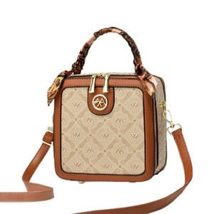Sac à main vintage en toile beige et cuir marron avec détail de foulard en soie