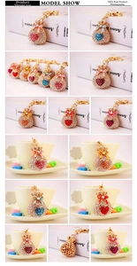 Detailed views of crystal-encrusted lucky bag keychains in multiple vibrant colors