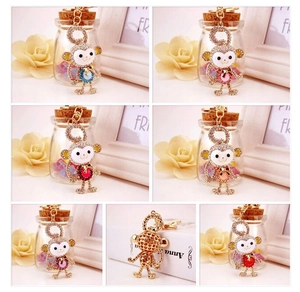 Detail view of multi-color crystal monkey keychains with sparkling rhinestones and alloy base