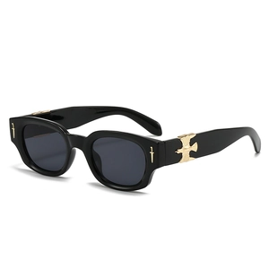 Fashionable oval sunglasses with golden eagle embossed detail and dark grey lenses