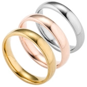 Detailed view of three-piece stainless steel rings in gold, rose gold and silver finish
