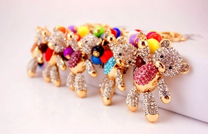 Macro shot of assorted rhinestone teddy bear keychains with colorful crystal embellishments