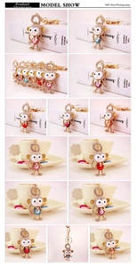 Detailed grid view of crystal-encrusted monkey keychains in various vibrant colors