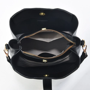 Top view detail of the black leather bucket bag with multi-compartments and gold hardware