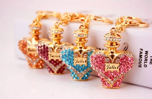 Macro shot of Juliet heart-shaped crystal perfume bottle keychains in four colors