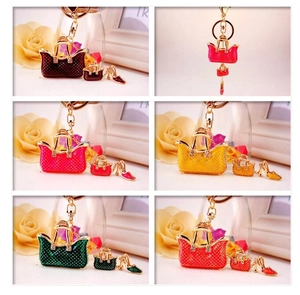Detail of colorful polka dot handbag keychains with rhinestones and shoe charms