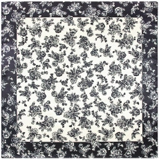 Detail shot of the vintage black and white floral pattern on a square silk scarf