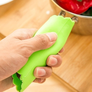 Éplucheur d'ail en silicone vert avec texture ondulée antidérapante pour la cuisine