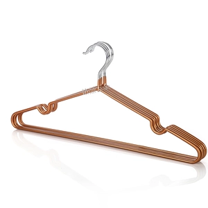 Close-up of rose gold metal hangers with non-slip notches and reinforced silver hooks