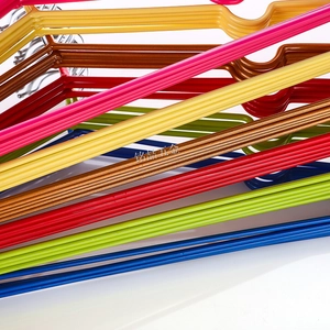Detail of colorful non-slip thickened metal hangers with grooved shoulder design