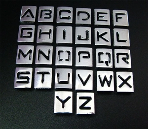 Detailed grid of 26 silver chrome alloy hollow alphabet letters for DIY jewelry making