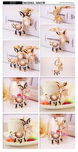Detail of cute donkey keychain with rhinestones and opal stones on metal lobster clasp