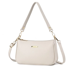 Detailed view of beige pebble leather shoulder bag with gold hardware and removable straps