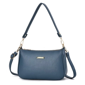 Dark blue lychee leather crossbody bag with gold metal trim and adjustable strap