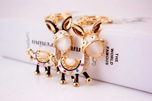 Macro detail of cute rhinestone donkey keychain with colorful crystals and enamel finish