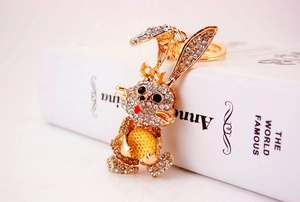 Detailed macro view of a golden bunny keychain with sparkling inlaid rhinestones