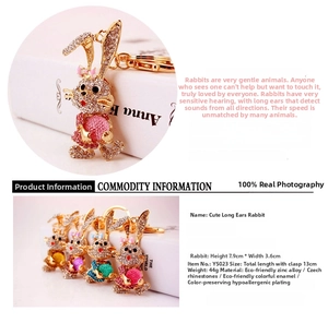 Detailed view of the rhinestone bunny keychain showing dimensions and color options