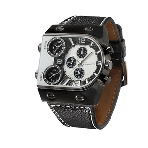 Close-up of a square multi-timezone quartz watch with black leather strap and bold dial