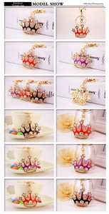 Detailed views of crystal crown keychains in red black purple and gold alloy finishes
