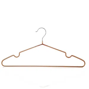 Close-up of rose gold metal hangers with non-slip notches and silver hooks on white background