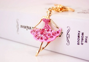 Close-up of pink rhinestone ballet girl keychain with gold-tone metal frame