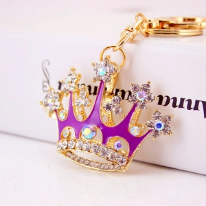Creative gold-plated crown keychain with purple enamel and sparkling rhinestones