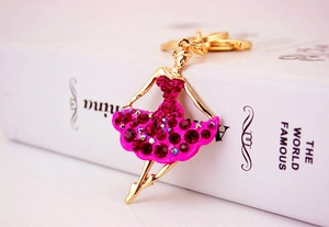 Close-up of ballet dancer keychain with magenta rhinestones and gold plating detail