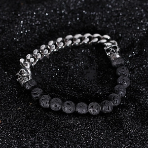 Gothic skull bracelet featuring black lava stone beads and silver Cuban link chain