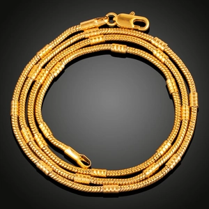 Elegant 18K gold plated snake chain necklace with cylindrical accents on black background
