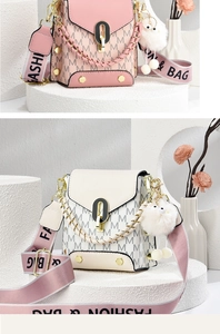 Detail of trendy crossbody bags featuring 'M' print, chain handle and plush charm