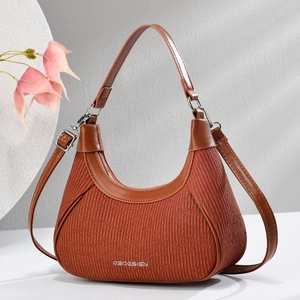 Elegant orange-brown hobo shoulder bag with pleated fabric and premium brown leather trim