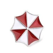 Detailed close-up of a red and white octagonal umbrella logo enamel metal badge pin