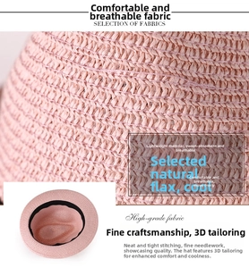 Détail d'un chapeau de paille en lin rose montrant la texture respirante et la coupe
