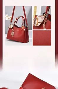 Detail of red lychee leather handbag with silk scarf handle and pearl leaf pendant