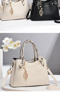 Detailed macro view of lychee leather handbags with silk scarf handles and gold logos