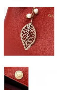 Detail of red leather handbag with gold leaf pendant, white pearls and magnetic closure
