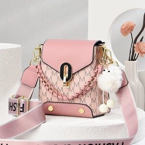 Pink monogram shoulder bag with M-pattern leather, gold hardware and plush charm