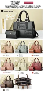 Detail view of crocodile pattern faux leather handbag set with small chain pouch