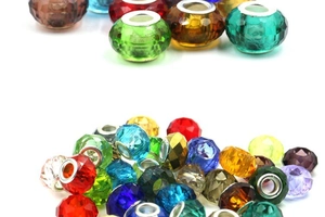 Macro view of multi-colored faceted crystal glass beads with large metal holes