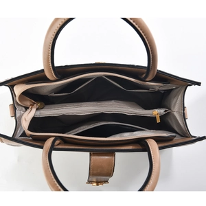 Internal view of brown tote bag with multiple zip compartments and patterned lining