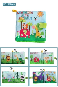 Macro detail of baby soft cloth book with colorful 3D animals and hanging strap