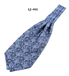 Detail of blue paisley ascot tie for men featuring premium satin texture and pattern
