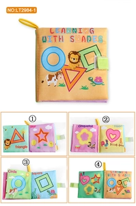 Detail of baby soft cloth book showing colorful shapes and velcro closure for early learning