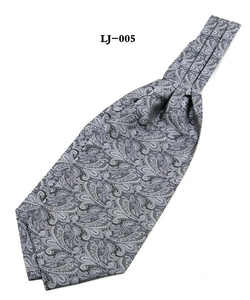 Close-up of grey paisley pattern on a men's satin ascot tie with intricate details