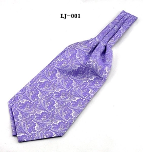 Detail of purple paisley jacquard ascot tie for men with intricate woven patterns